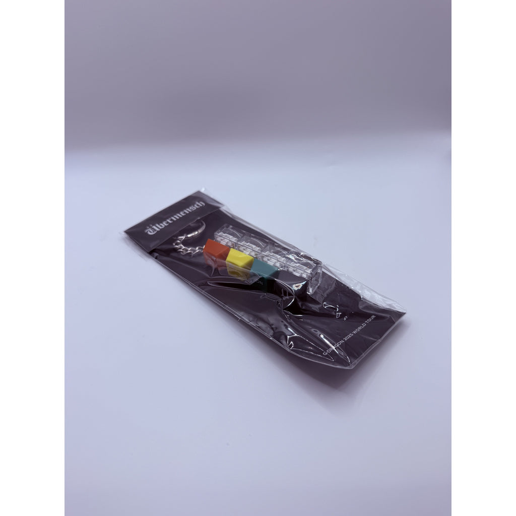 G-DRAGON Übermensch World Tour Keycap Keyring — front