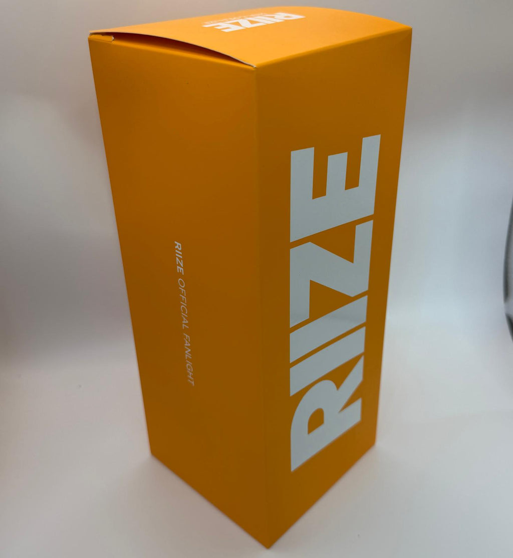 RIIZE Official Light Stick orange retail box – angled view