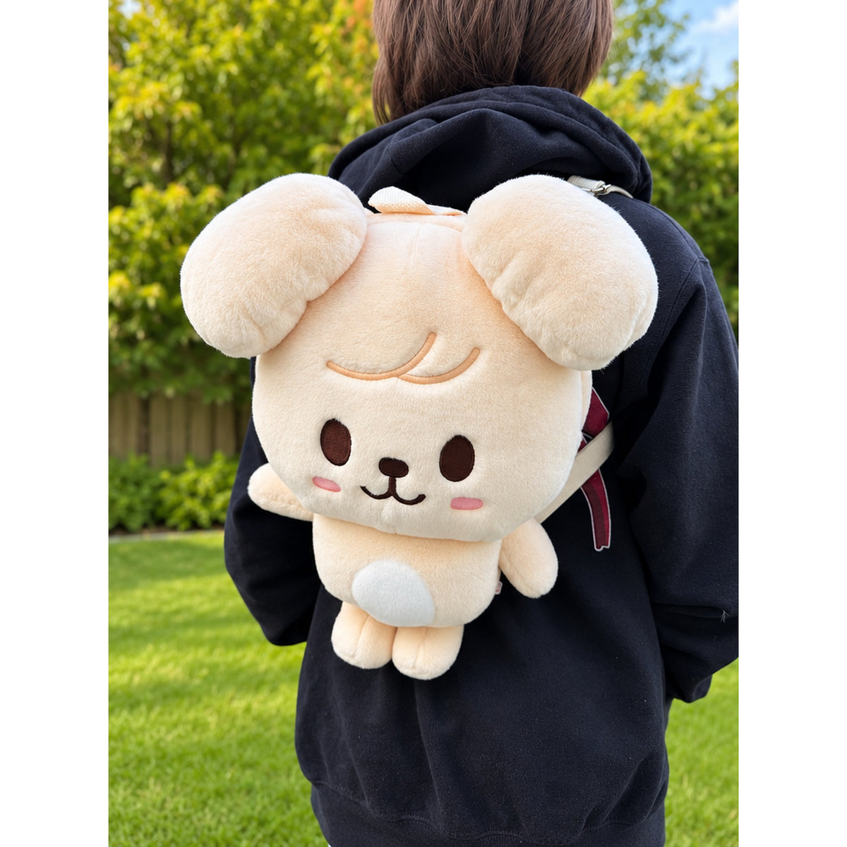 Stray Kids SKZOO PuppyM plush backpack worn outdoors
